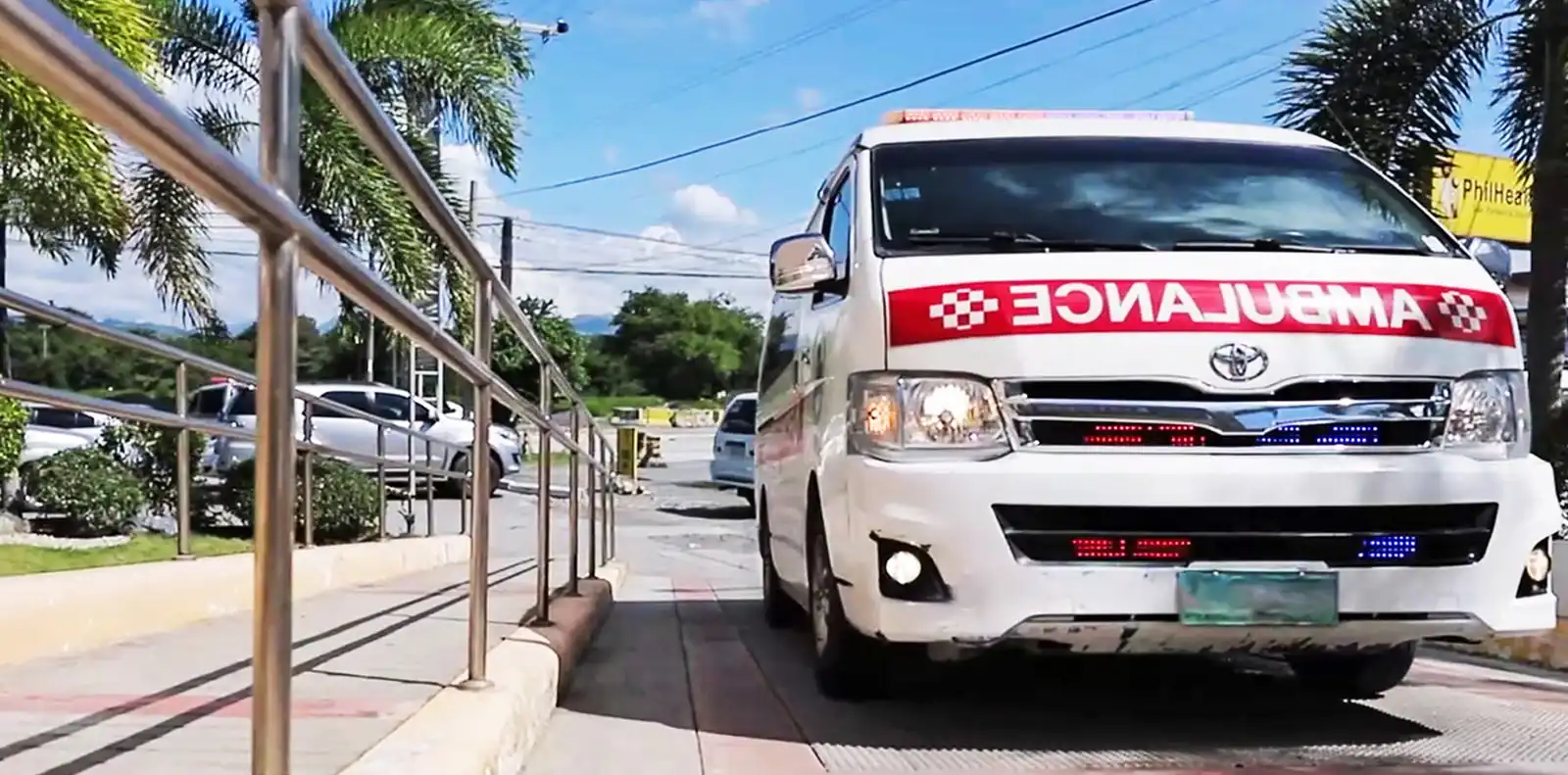 An ACE Baypointe ambulance drawn up on the ramp outside the hospital's Emergency entrance.
